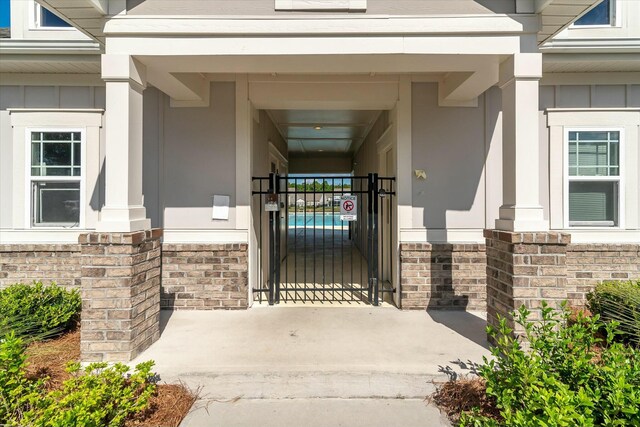 127 Surfbird Rd, Summerville, SC 29486 - doorway to property featuring a gate and board and batten siding