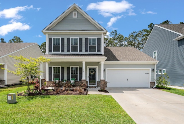 127 Surfbird Rd, Summerville, SC 29486 - view of front facade featuring an attached garage, a shingled roof, concrete driveway, a porch, and a front lawn