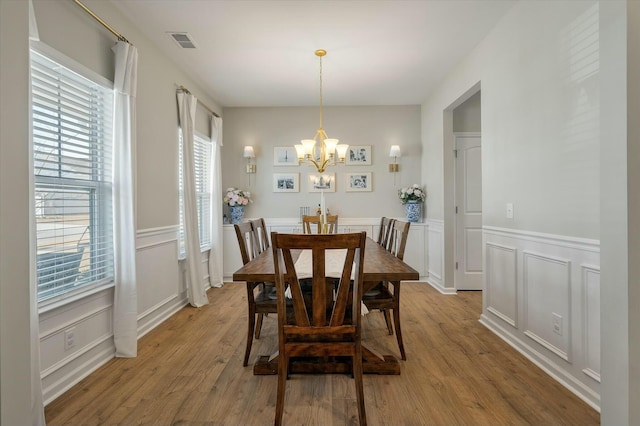 127 Surfbird Rd, Summerville, SC 29486 - dining room featuring an inviting chandelier, a decorative wall, and plenty of natural light