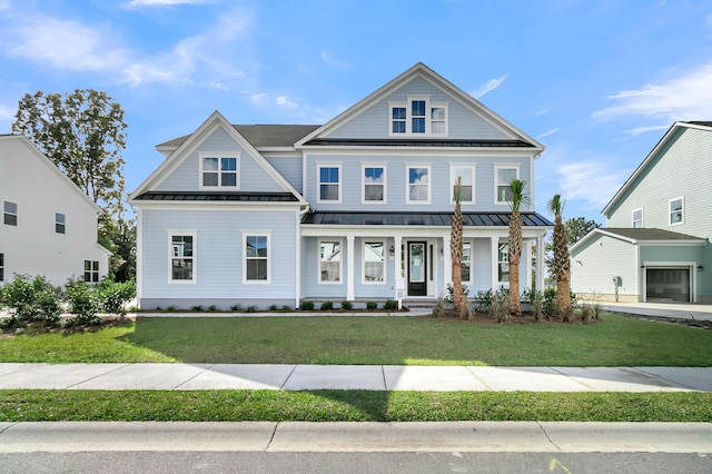 view of front facade featuring a front yard and covered porch