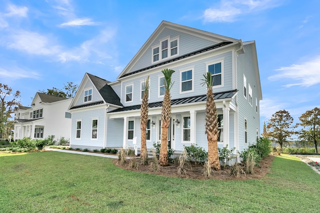 view of front of home with covered porch and a front yard