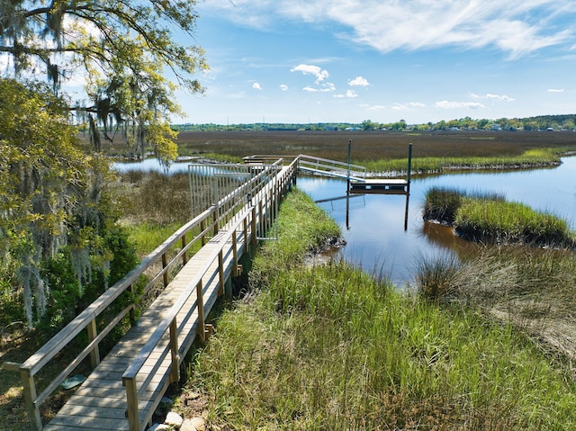 dock area featuring a rural view and a water view