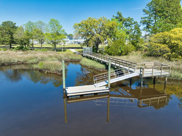 dock area featuring a water view