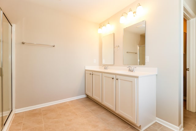 bathroom featuring vanity, walk in shower, and tile patterned floors