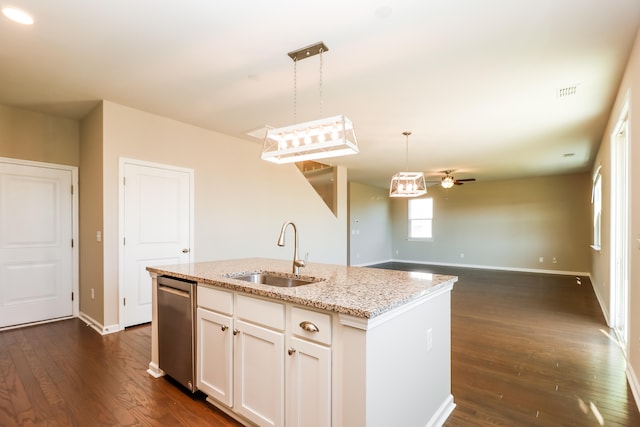 kitchen featuring dishwasher, dark wood-type flooring, a kitchen island with sink, and sink