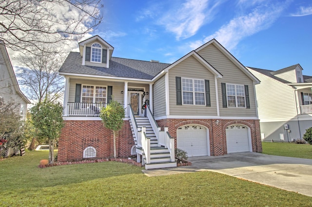 view of front of home featuring covered porch, a front yard, and a garage