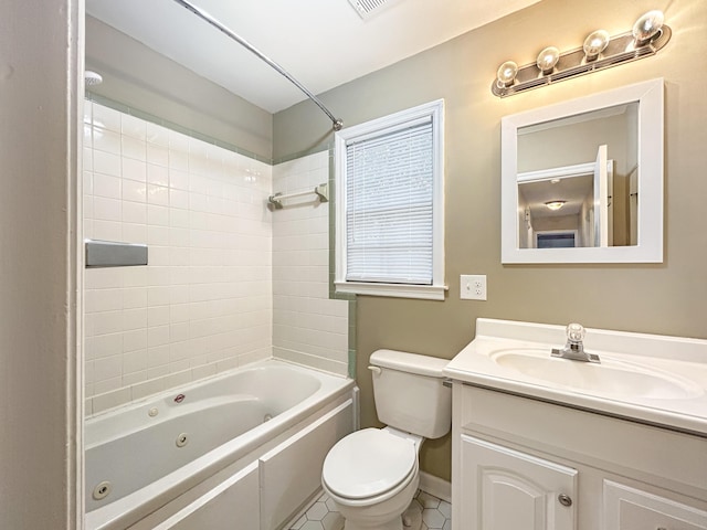 bathroom with vanity, baseboards, tile patterned floors, toilet, and a combined bath / shower with jetted tub