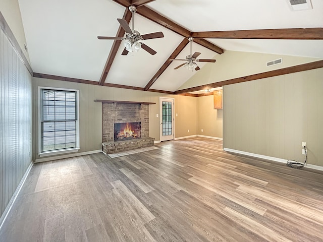 unfurnished living room featuring visible vents, baseboards, a brick fireplace, a ceiling fan, and light wood finished floors