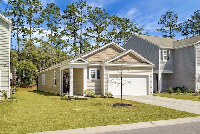 view of front of home with a front yard, a garage, and driveway