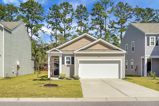 craftsman-style home with an attached garage, concrete driveway, and a front lawn