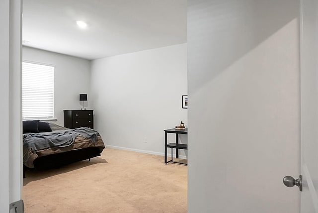 carpeted bedroom with baseboards