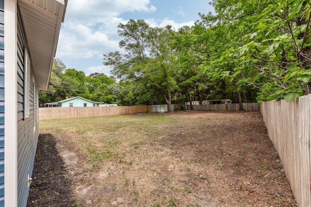 view of yard with a fenced backyard