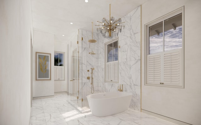 bathroom featuring an inviting chandelier, marble finish floor, a soaking tub, and a shower with door