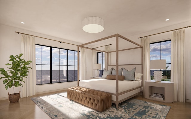bedroom featuring baseboards, multiple windows, and recessed lighting