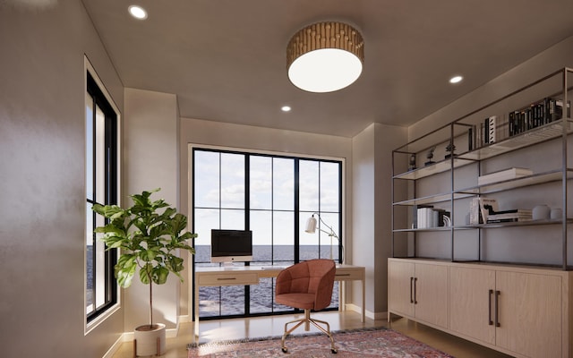 office space with baseboards and recessed lighting