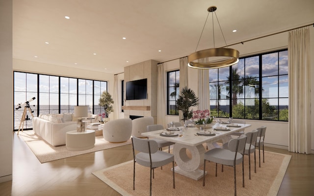 dining room with a fireplace and recessed lighting