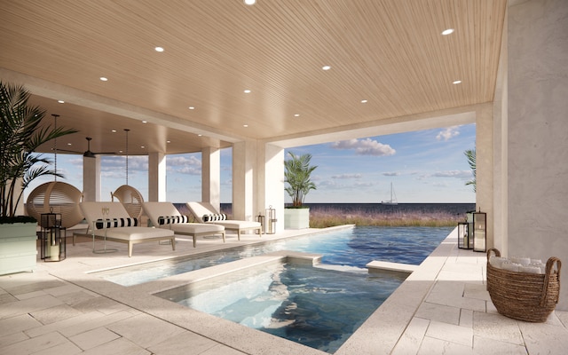 view of swimming pool with a patio area and an in ground hot tub