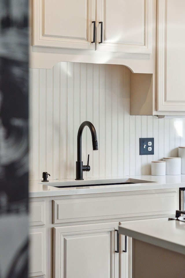 details with sink, refrigerator, and tasteful backsplash