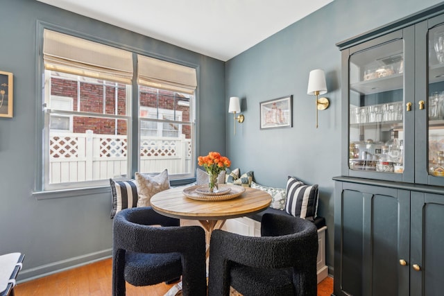 dining room featuring light hardwood / wood-style flooring and a healthy amount of sunlight