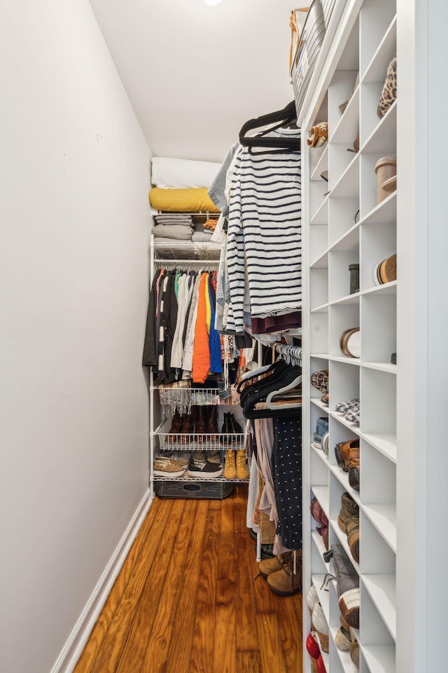 spacious closet featuring hardwood / wood-style floors