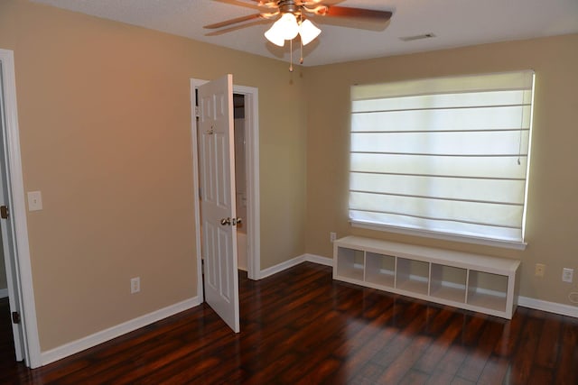 7947 Vermont Rd, North Charleston, SC 29418 - spare room featuring wood finished floors, ceiling fan, and baseboards