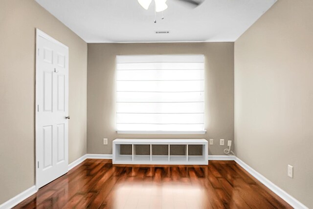 7947 Vermont Rd, North Charleston, SC 29418 - empty room with a ceiling fan, wood finished floors, and baseboards