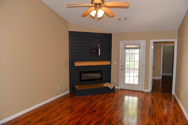 7947 Vermont Rd, North Charleston, SC 29418 - unfurnished living room featuring a large fireplace, vaulted ceiling, baseboards, wood finished floors, and a ceiling fan