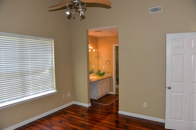7947 Vermont Rd, North Charleston, SC 29418 - unfurnished room with ceiling fan, dark wood-style flooring, baseboards, and a sink