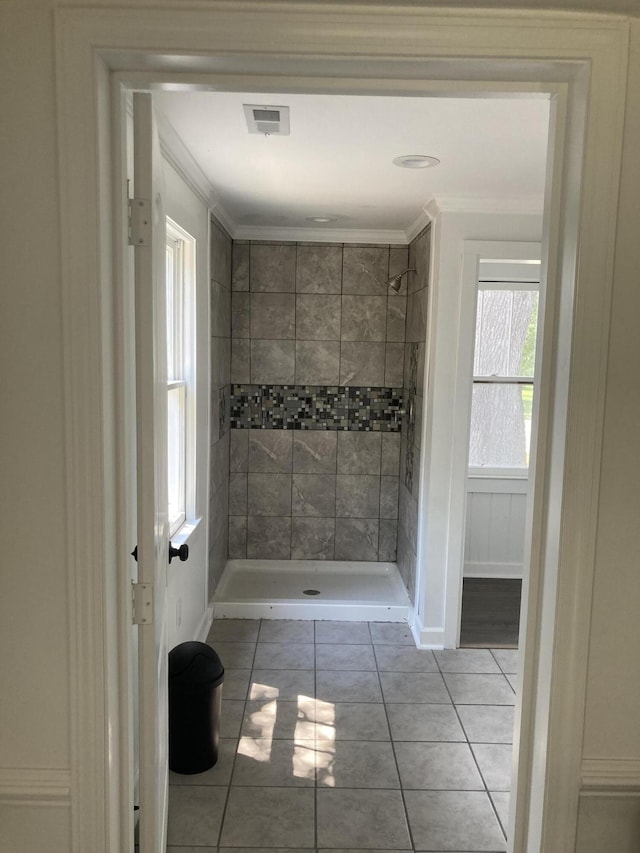 110 Groves St, Walterboro, SC 29488 - bathroom featuring tiled shower, tile patterned floors, and ornamental molding