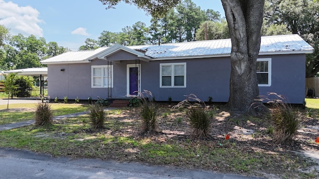 110 Groves St, Walterboro, SC 29488 - single story home featuring metal roof, stucco siding, and an attached carport