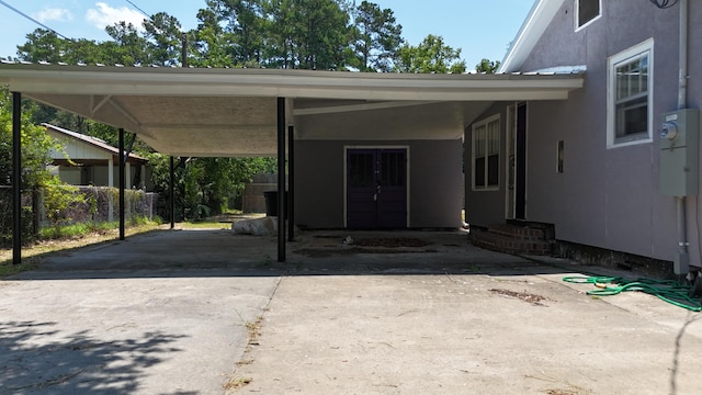 110 Groves St, Walterboro, SC 29488 - view of vehicle parking featuring a carport, concrete driveway, fence, and entry steps