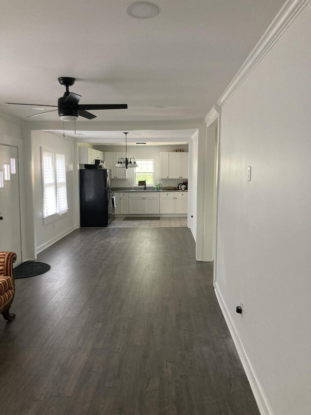 110 Groves St, Walterboro, SC 29488 - unfurnished living room with baseboards, dark wood-style floors, and a ceiling fan