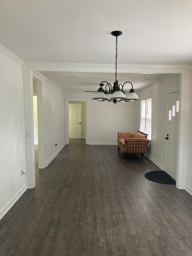 110 Groves St, Walterboro, SC 29488 - unfurnished dining area with ornamental molding, baseboards, dark wood finished floors, and a chandelier
