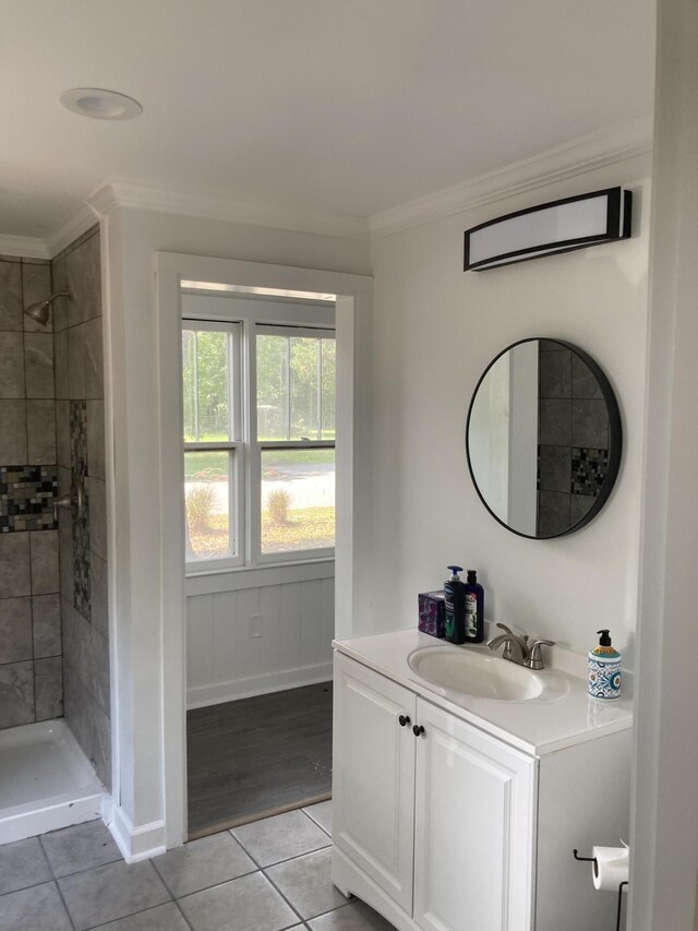 110 Groves St, Walterboro, SC 29488 - bathroom with tile patterned flooring, tiled shower, vanity, and ornamental molding