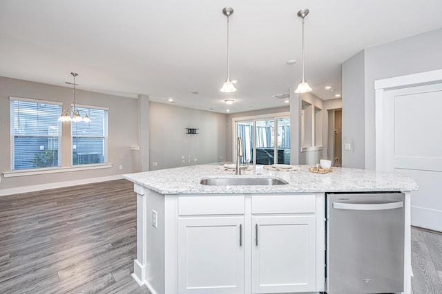 kitchen with stainless steel dishwasher, sink, light hardwood / wood-style flooring, white cabinetry, and plenty of natural light