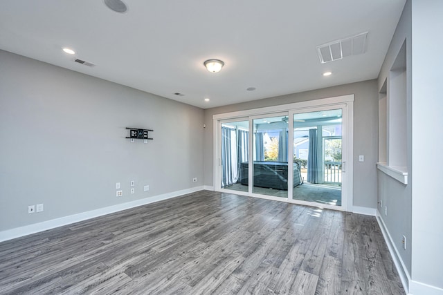 unfurnished room featuring hardwood / wood-style flooring