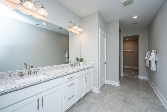 bathroom featuring tile patterned floors and vanity