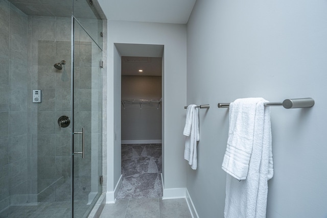 bathroom featuring tile patterned floors and an enclosed shower