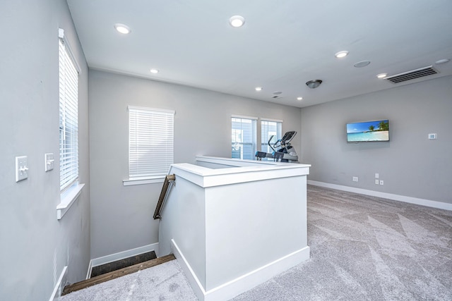 kitchen featuring light carpet