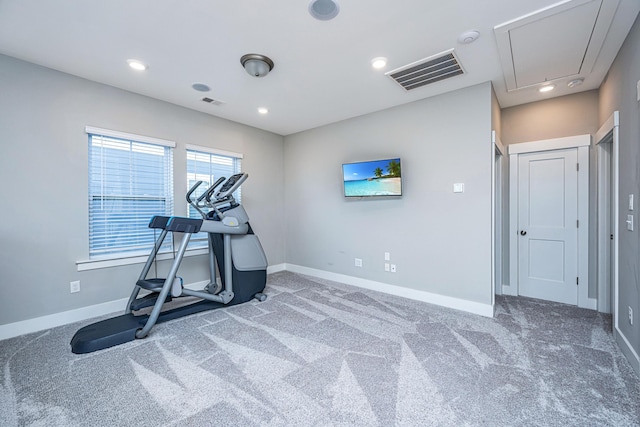 exercise area featuring dark colored carpet