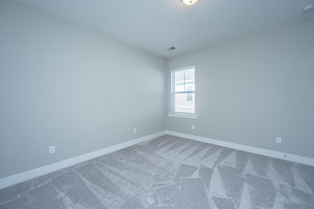 spare room with carpet floors