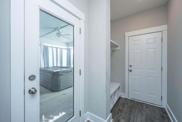 mudroom with ceiling fan and dark wood-type flooring