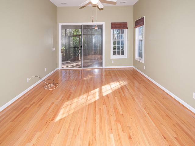 unfurnished room featuring light hardwood / wood-style flooring and ceiling fan