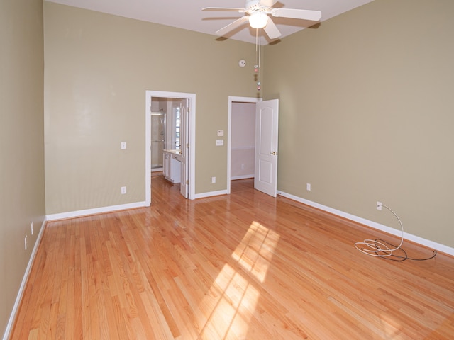 unfurnished bedroom with ceiling fan and light hardwood / wood-style floors