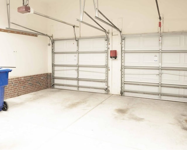 garage featuring a garage door opener