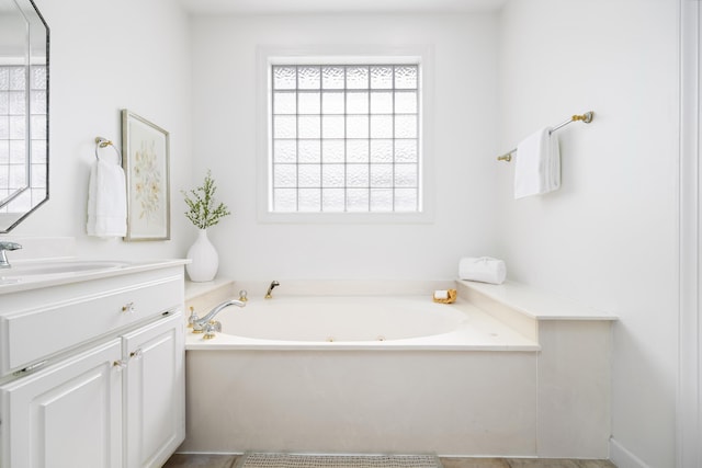 bathroom featuring sink and a tub