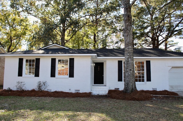 ranch-style house featuring a garage