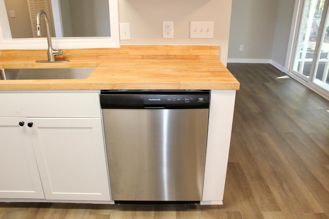 kitchen with dishwasher, dark hardwood / wood-style flooring, white cabinetry, and sink