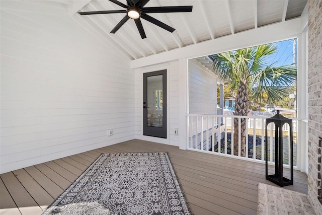 wooden terrace featuring a ceiling fan