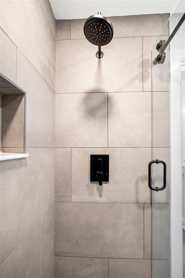 bathroom with a shower stall